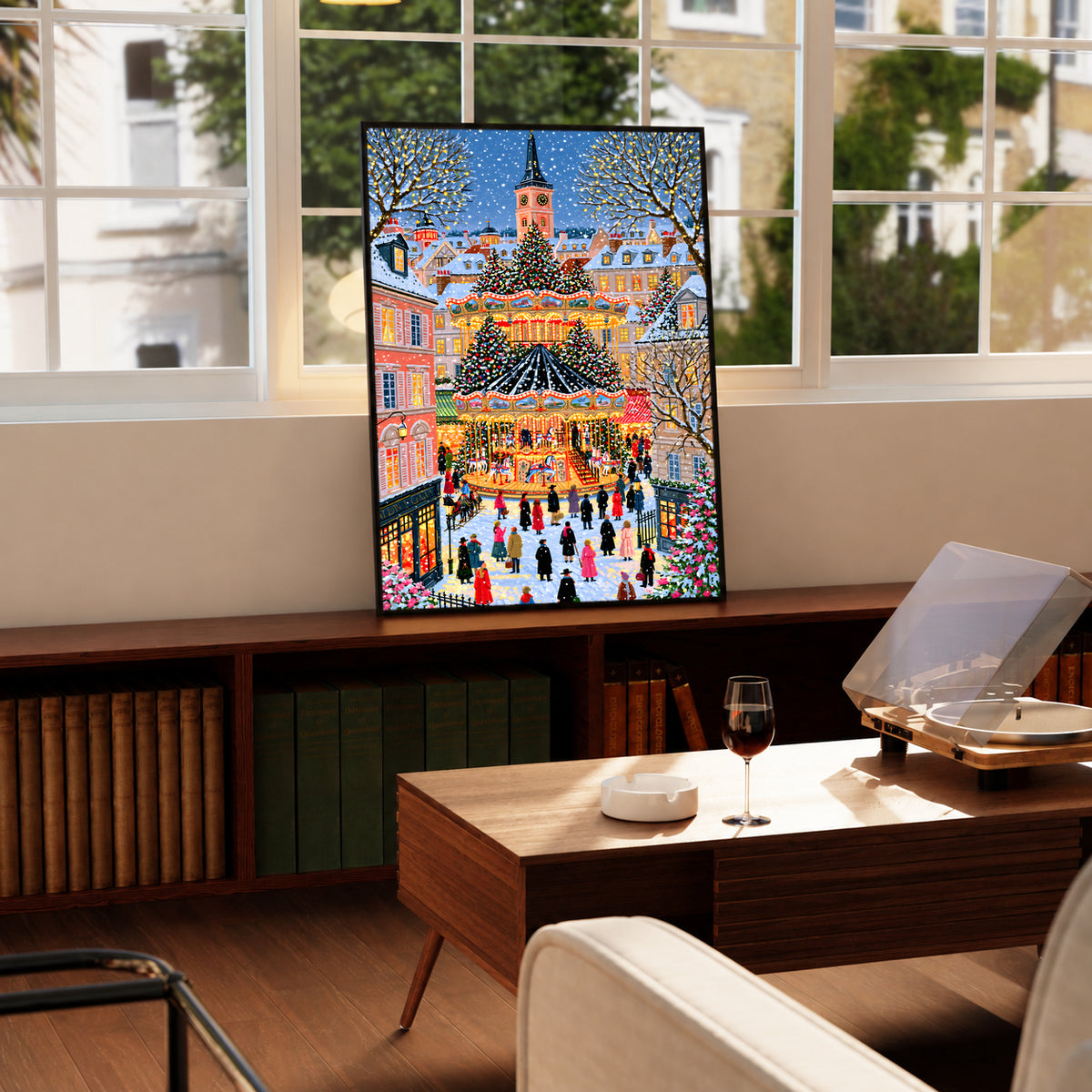 Christmas carousel art print in a black frame, featuring a busy winter village square.