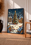Framed Christmas village art print with a decorated tree, snowy market square, and stalls