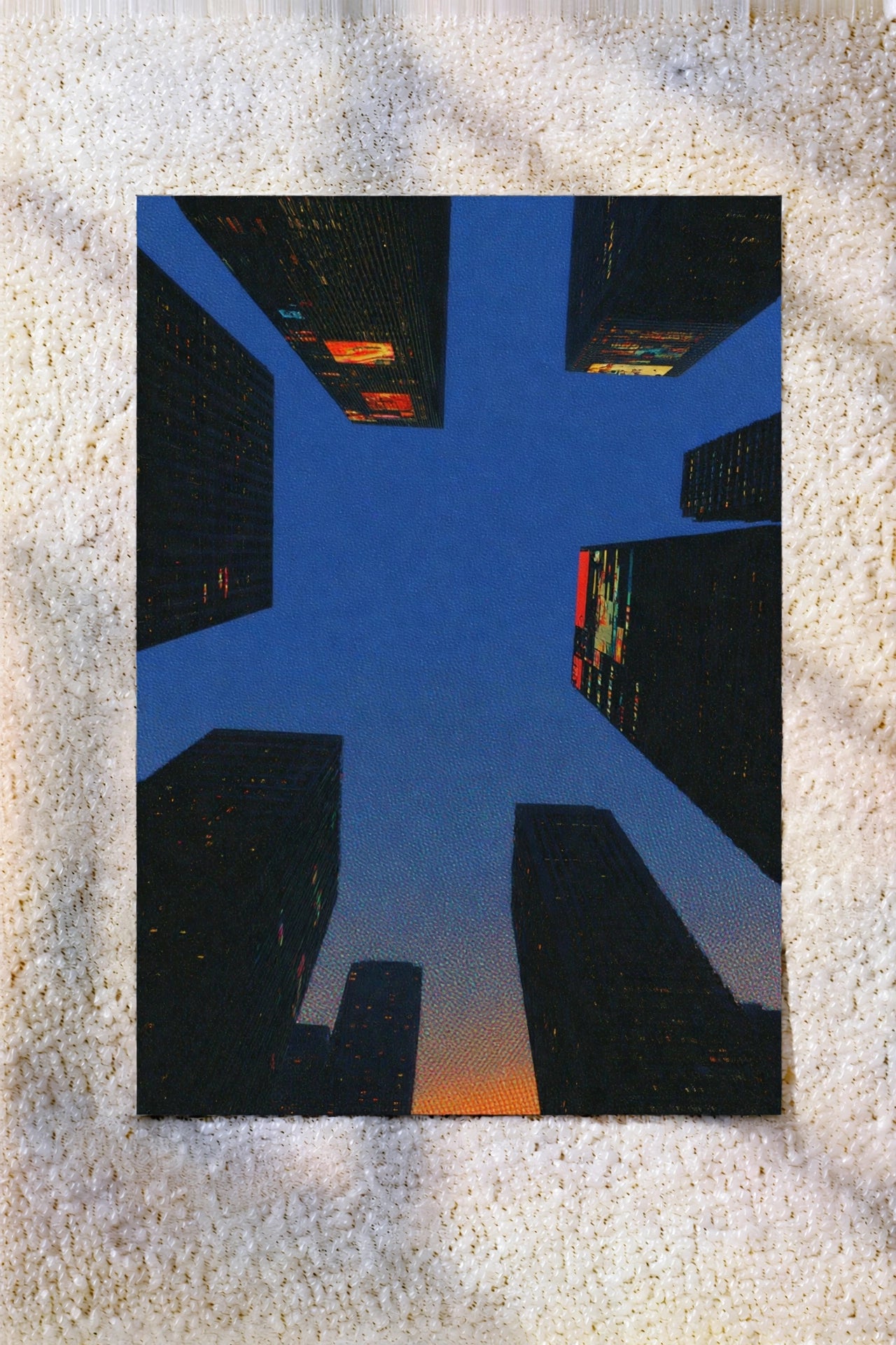 Square abstract city life artwork print with blue buildings and orange details