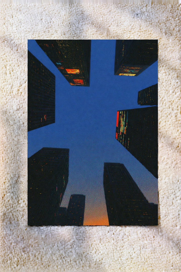 Square abstract city life artwork print with blue buildings and orange details