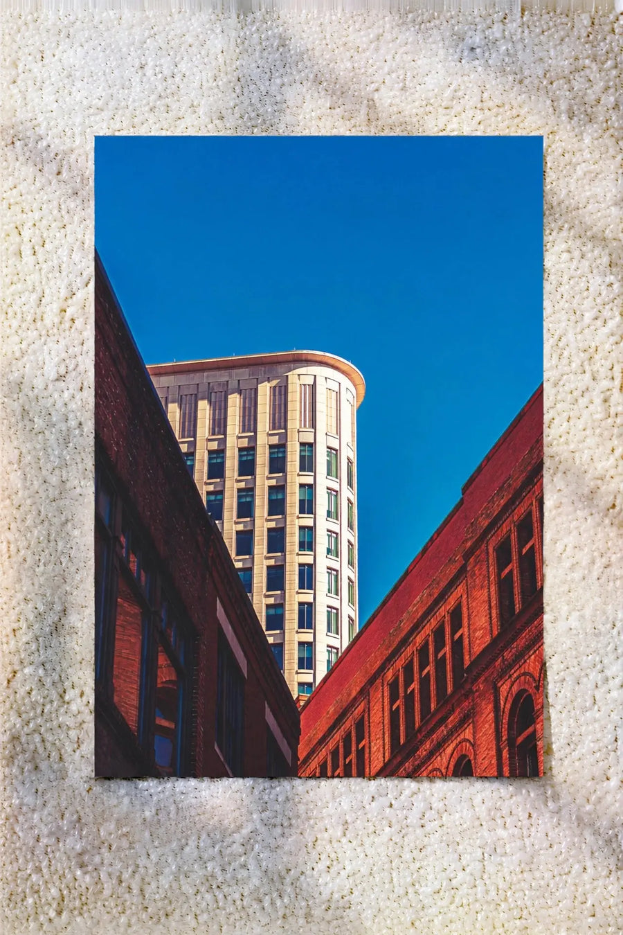 Urban city lines art print with blue sky and red brick buildings