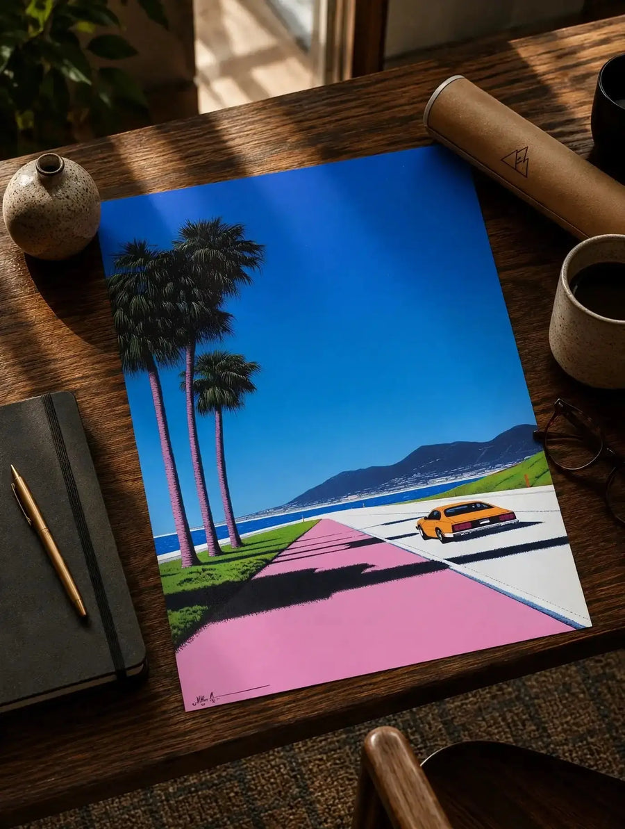 Coastal road art print on tabletop: palm trees, pink walkway, blue sky, yellow car