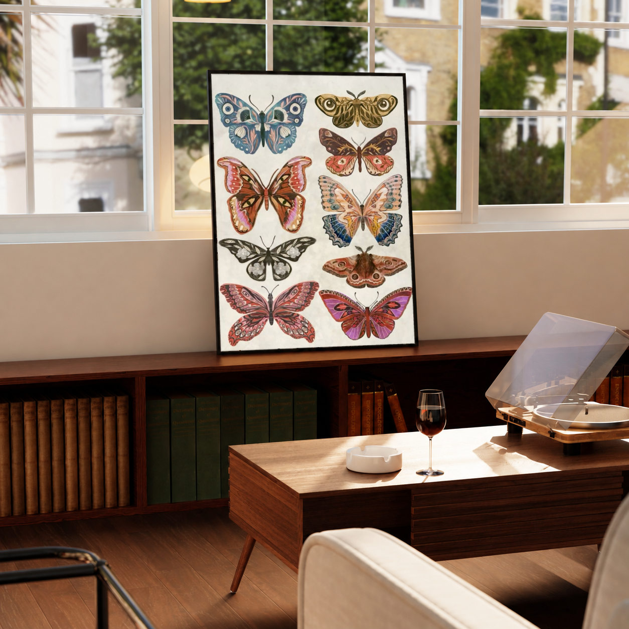 Framed butterfly and moth print with colorful insect illustrations on a white background