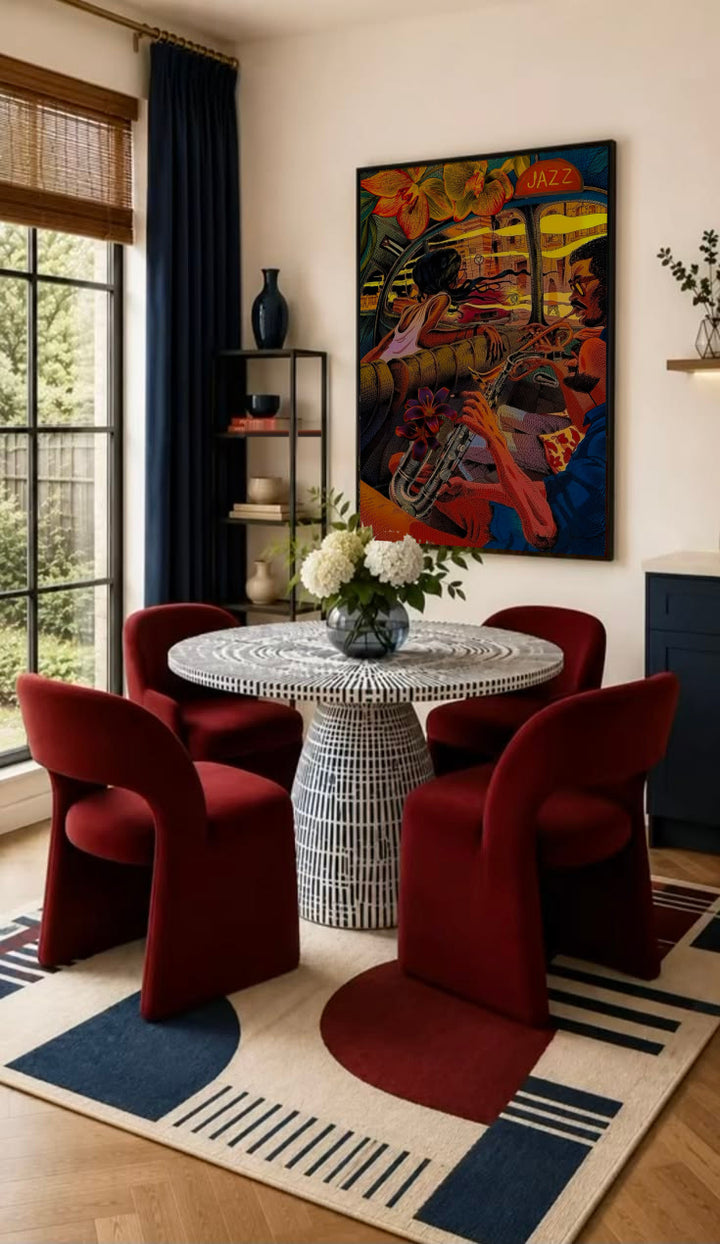 A trumpet player and lively jazz club interior in orange, red, yellow and deep blue in a black frame on the wall of a dining nook with red chairs