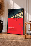Street pedestrians above a red field with Connection text and two blue cable shapes in a black frame leaning on a sunlit floor beside a rattan chair
