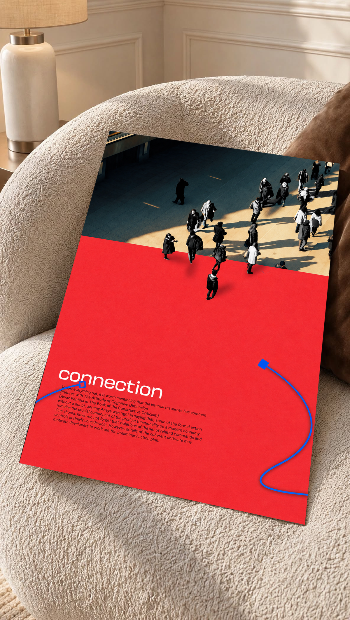 Street pedestrians above a red field with Connection text and two blue cable shapes as an unframed poster resting on a cream woven chair