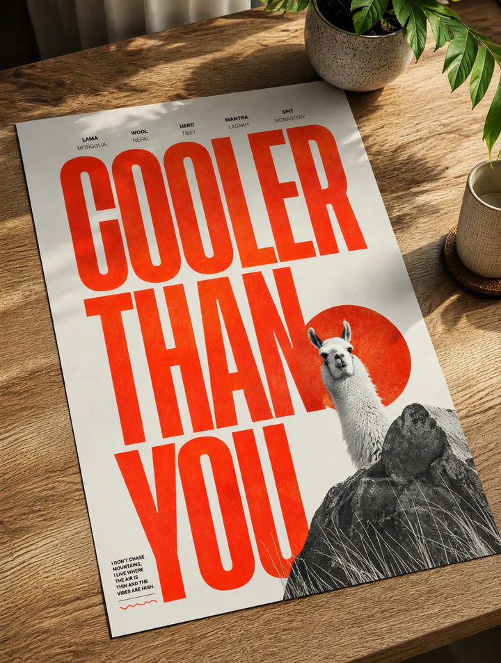 Paper poster wall art with red "COOLER THAN YOU" text and llama on rocks
