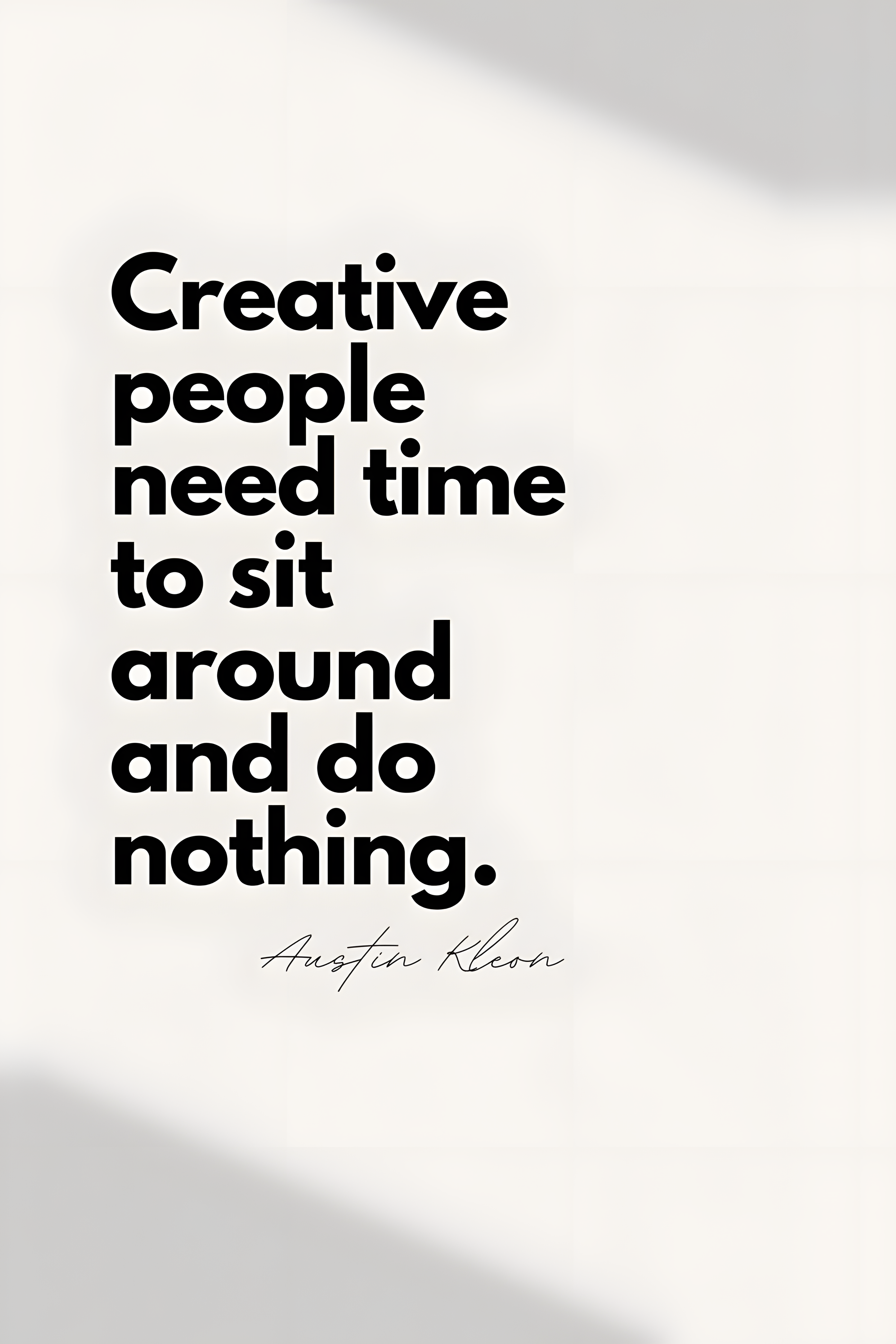 Minimal quote poster close-up with black typography and signature on white