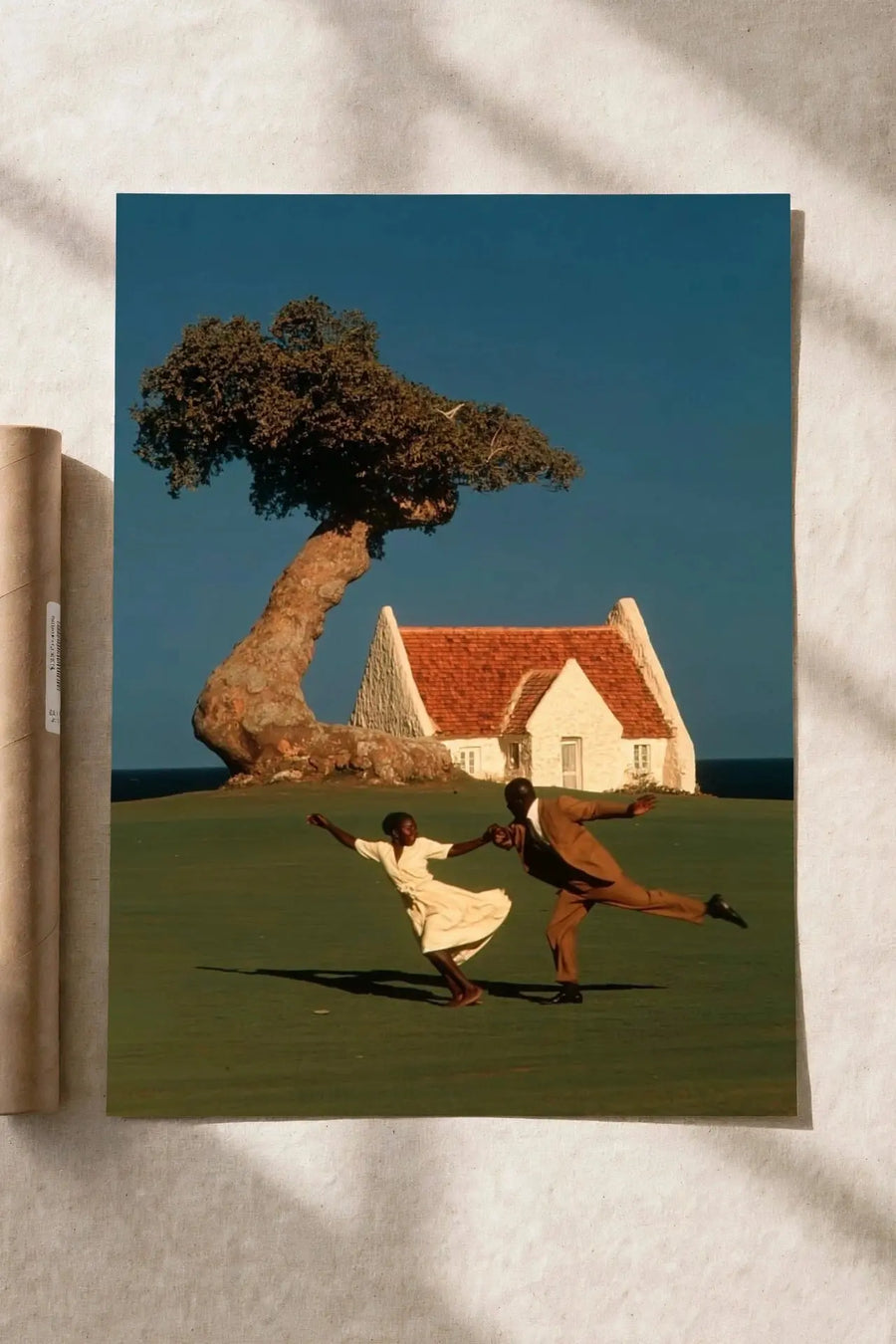 Dance By The Sea poster: people dancing in front of seaside cottage and large tree