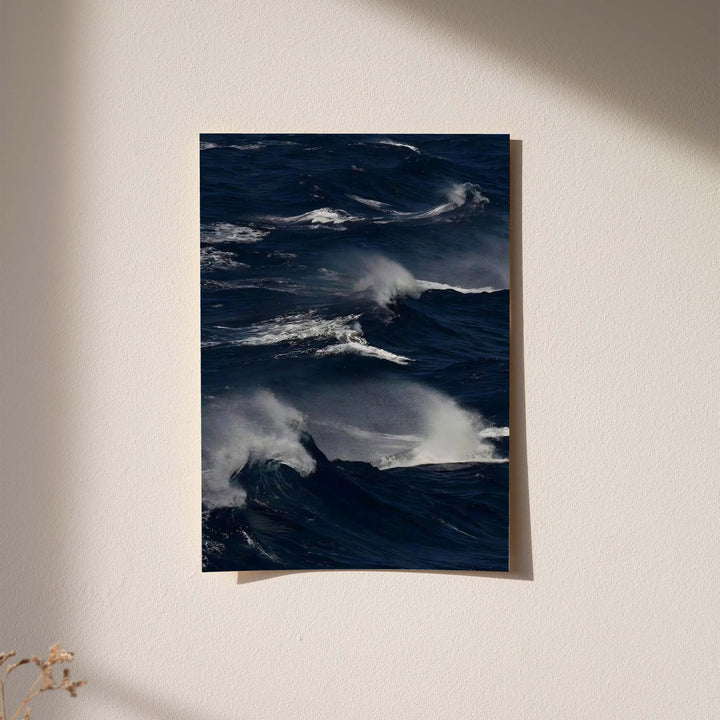 Dark blue ocean waves print with white crests and gray cloudlike sea texture