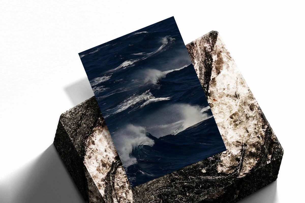 Unframed ocean waves print on dark blue water with white crests and mist