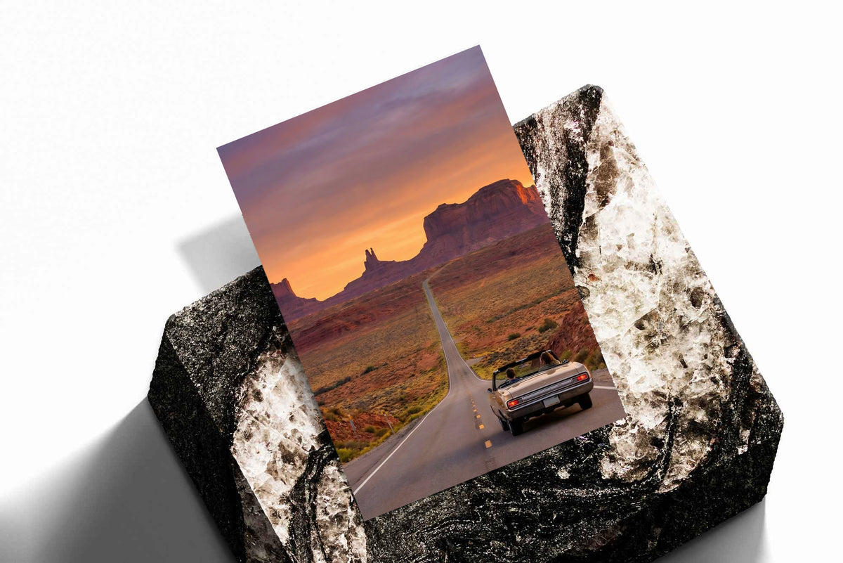 Desert road poster with convertible car shown on textured folded backing