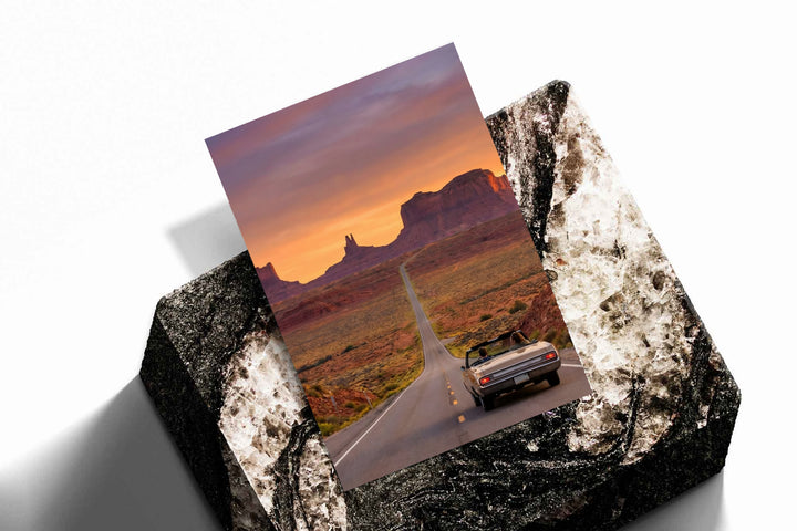 Desert road poster with convertible car shown on textured folded backing
