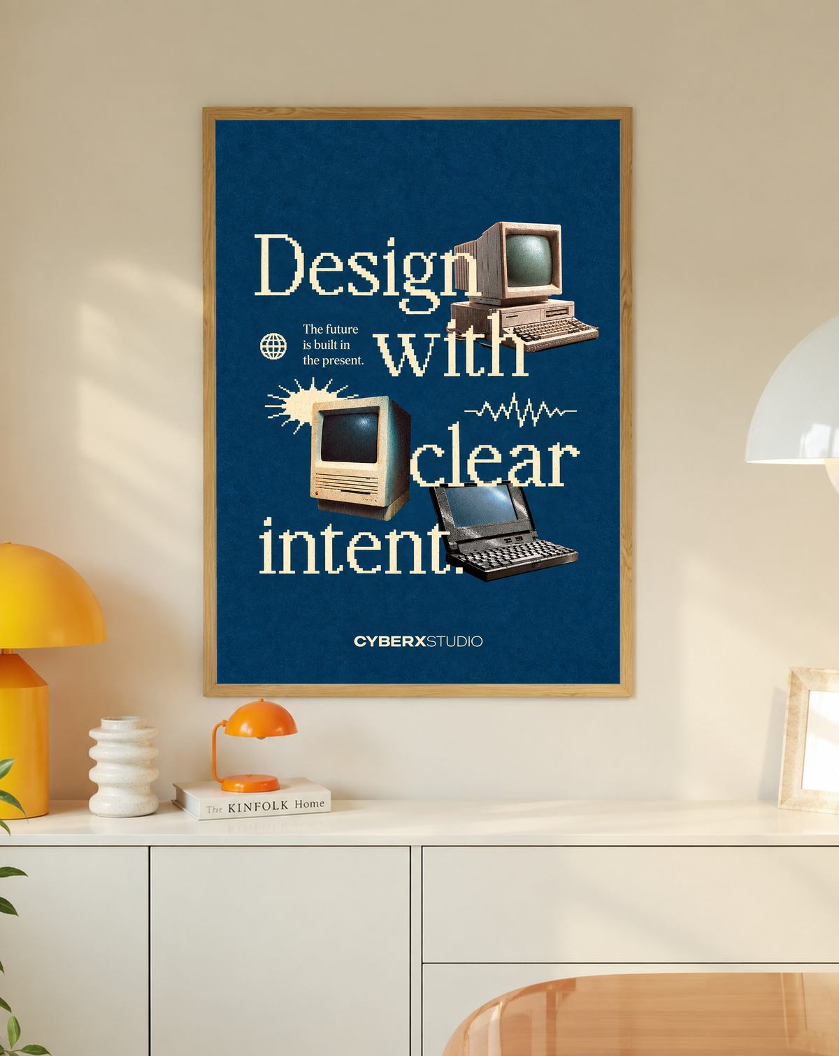 Framed retro computer poster with blue background, wood frame, “Design with clear intent” text