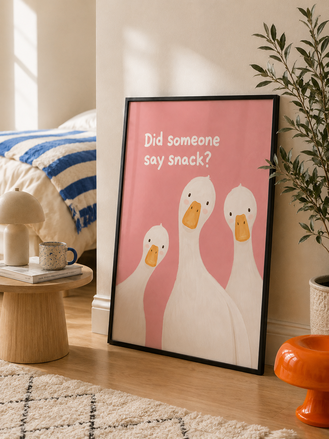 Framed goose wall art print with pink background and "Did someone say snack?" text