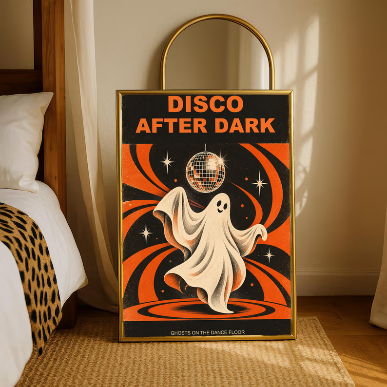 Ghost dancer poster with disco ball and orange swirls, in gold frame by bed