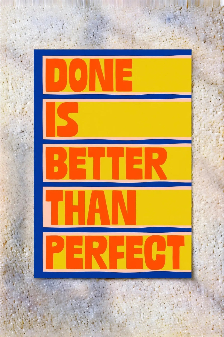 Framed motivational print with yellow background and block text: DONE IS BETTER THAN PERFECT