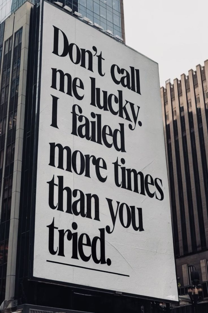 Black-and-white quote poster in dark frame with text “Don't call me lucky I failed”