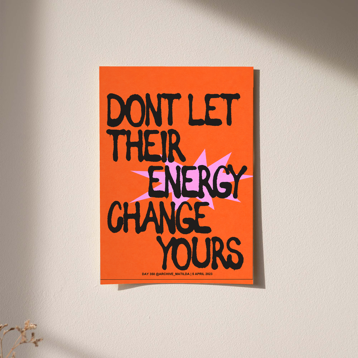 Orange poster with black quote text and pink accent letters