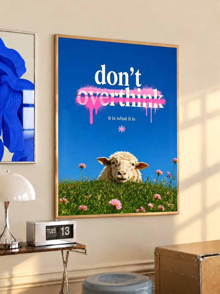 Framed meadow poster with sheep, pink flowers, and “don’t overthink” quote
