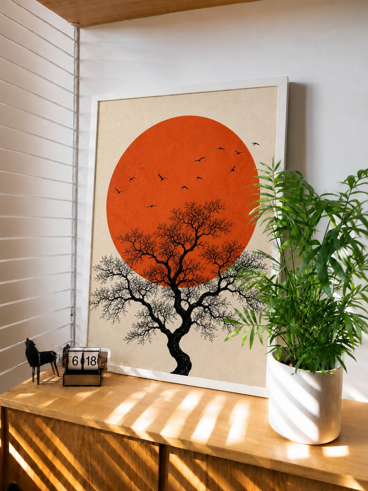 Minimalist sun and silhouetted tree wall art print in a white frame