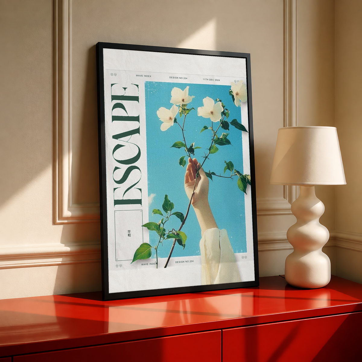 Floral poster in black frame, featuring a hand holding white flowers against blue