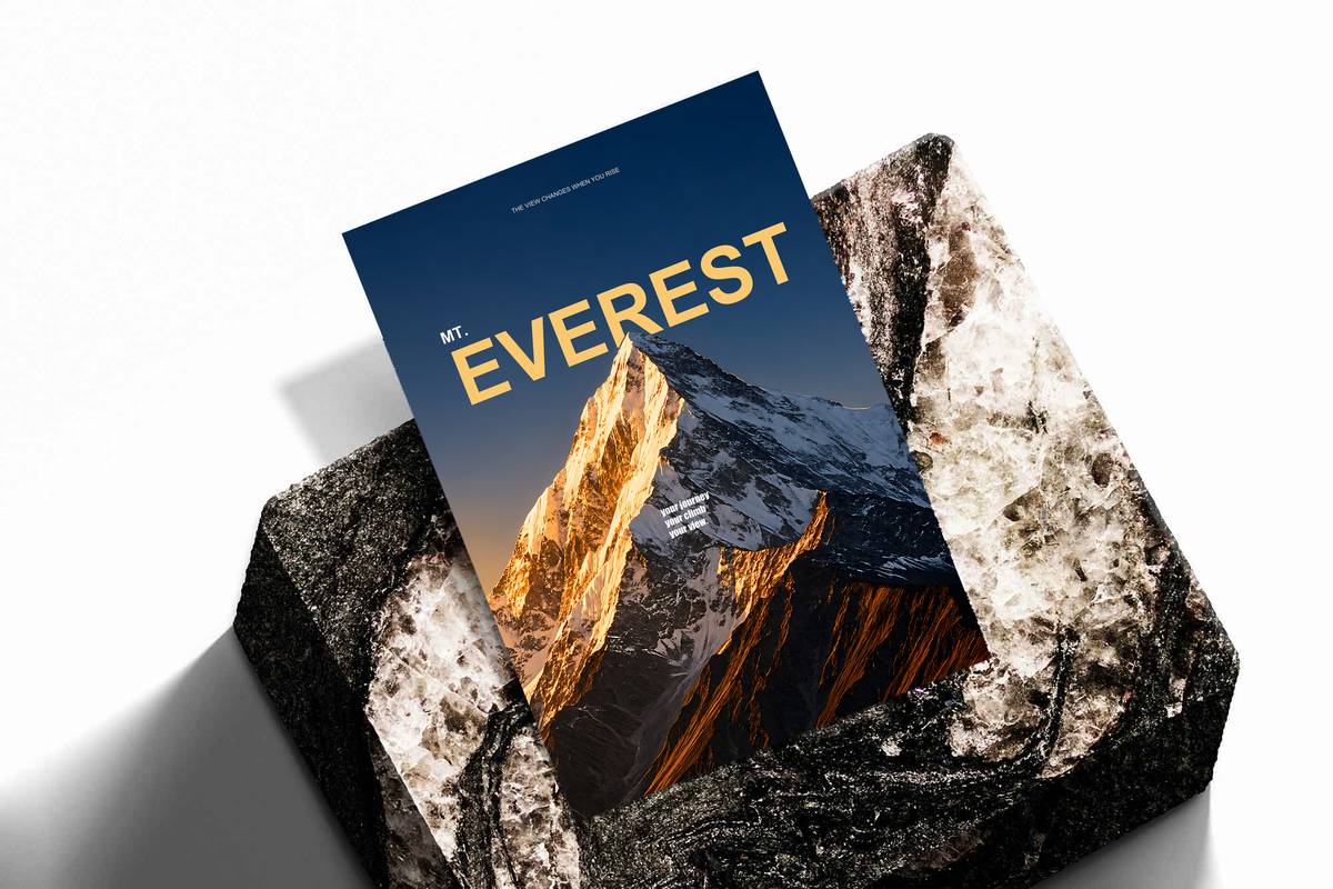 Golden light on a snowy Everest summit with yellow lettering on dark navy; unframed print on a stone display