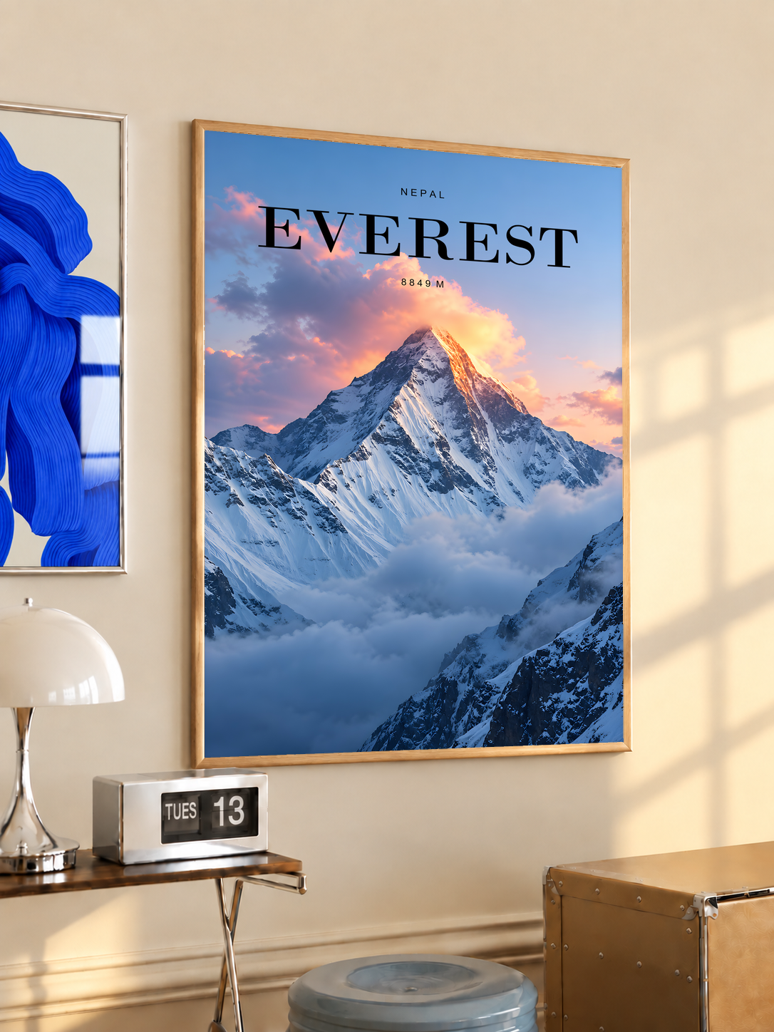 Snowy Everest peak rising through pink sunrise clouds; oak framed print in a desk setting