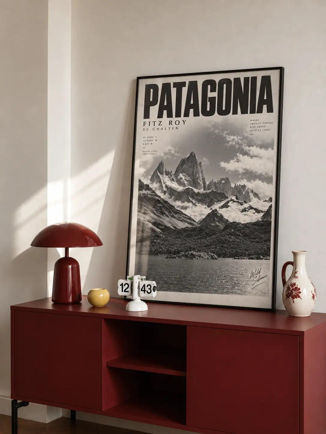 Patagonia Black and White Art displayed above a red console with bold Patagonia typography and vintage mountain scenery