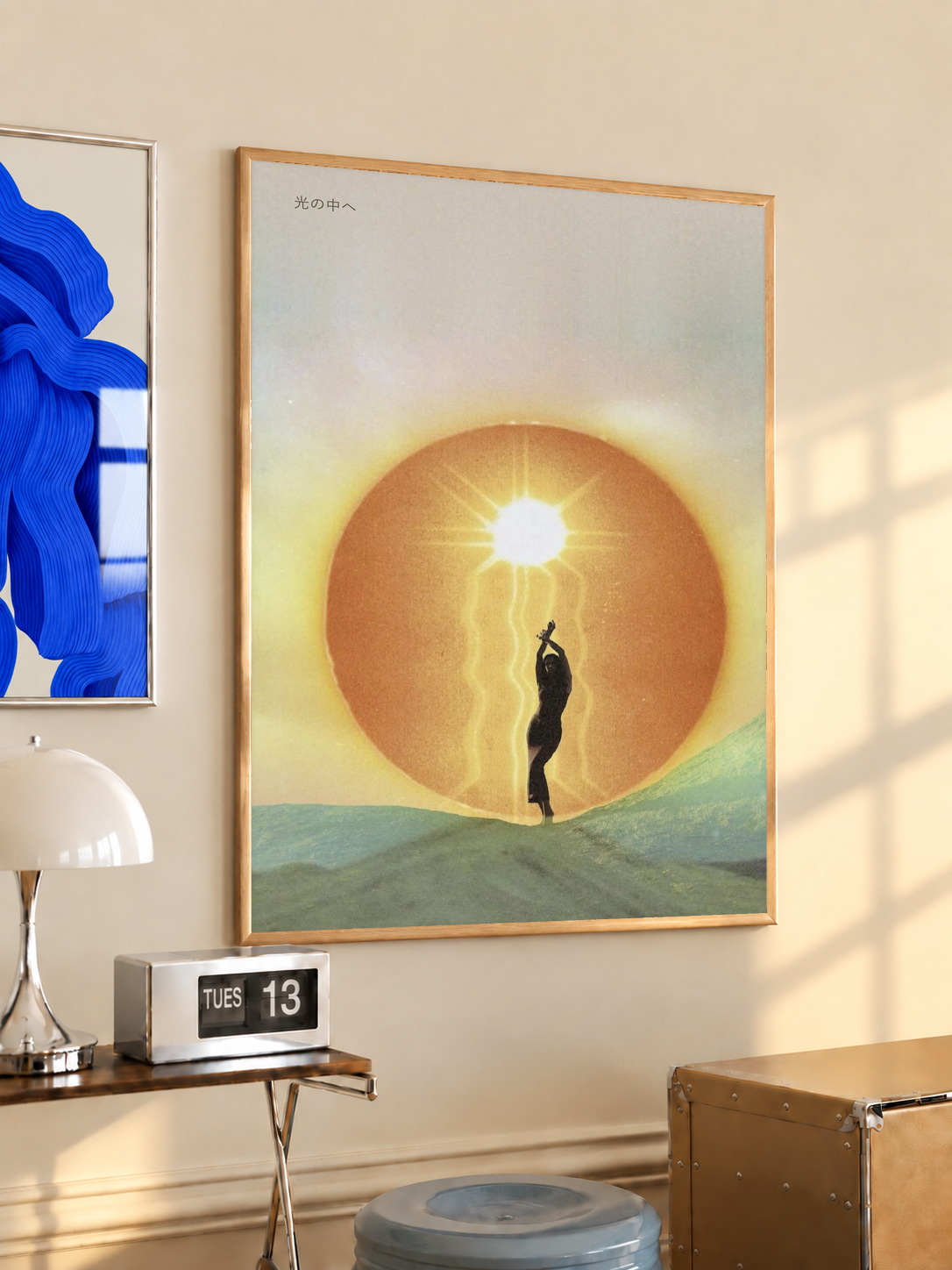 Surreal poster: silhouetted figure reaching into glowing sun halo, wood frame