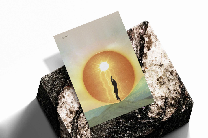 Figure reaching toward a glowing sun as an unframed print propped against a pale wall on a rough stone