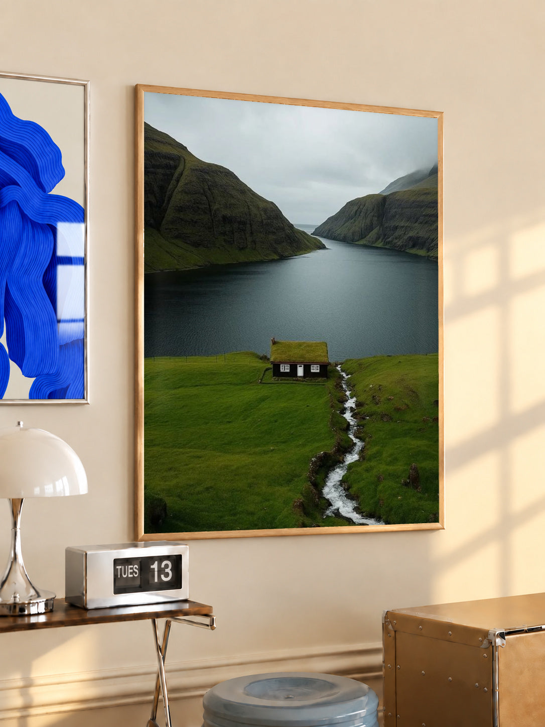 Framed cottage landscape print with green hills, fjord water, and narrow winding path