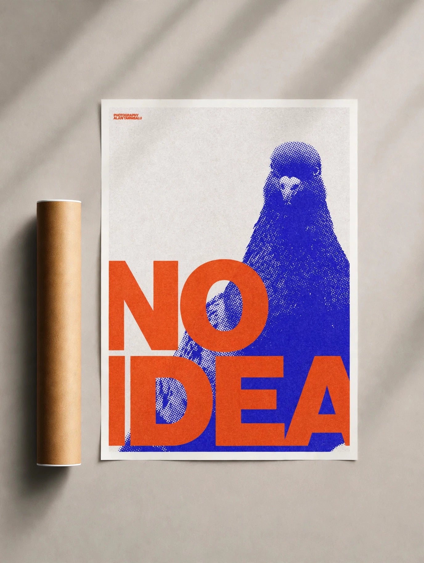 Pop art pigeon print with blue bird and bold orange “NO IDEA” lettering