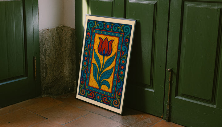 Framed tulip border poster leaning on floor with red-orange tulip and teal leaf pattern