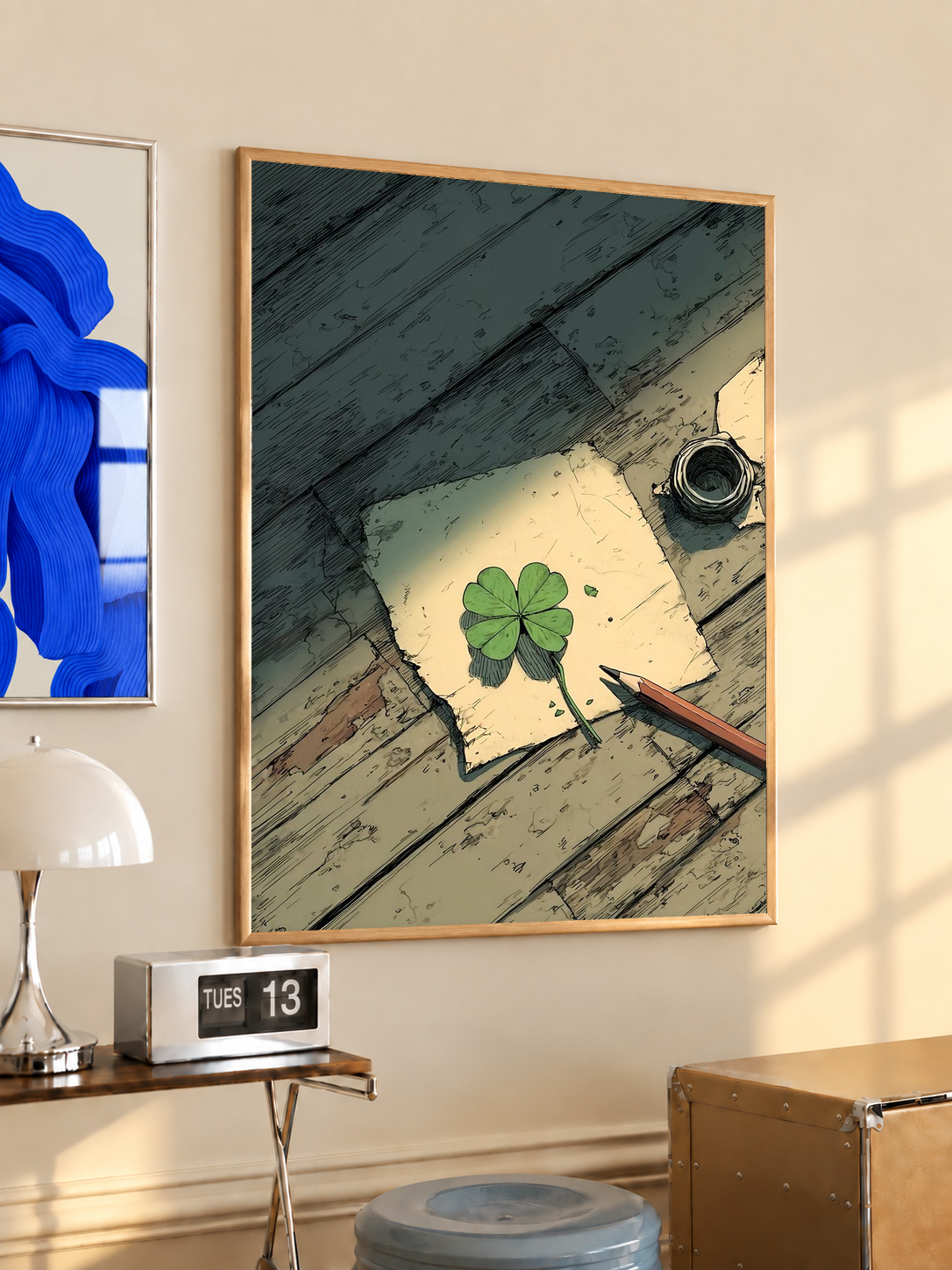 Black-framed desk art print with four-leaf clover sketch, pencil and ink bottle