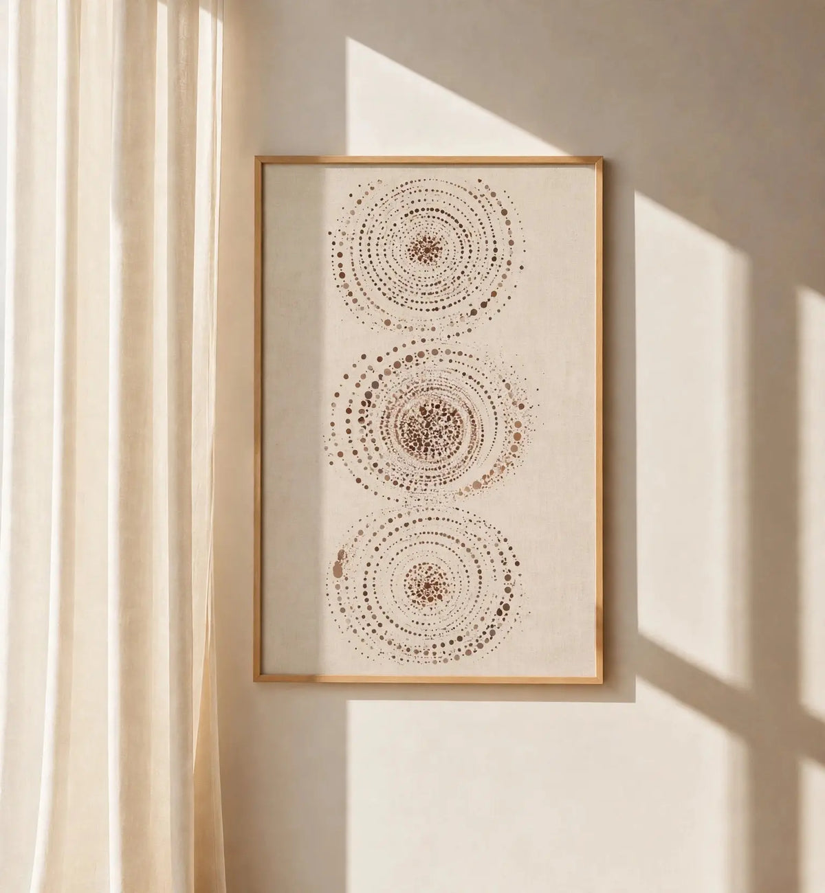 Abstract celestial wall art print with three dotted circular orbs in a brown frame