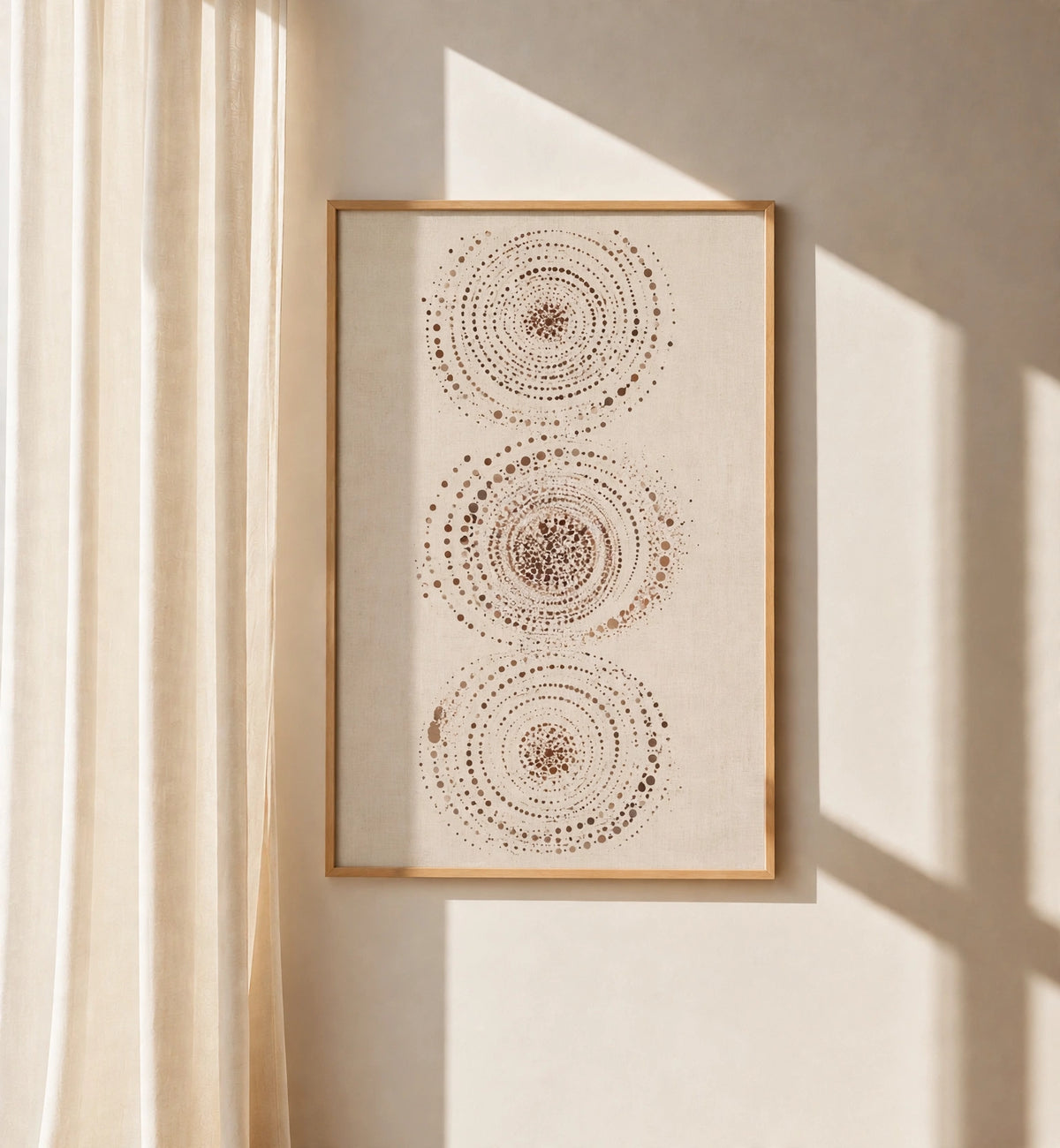 Abstract celestial wall art print with three dotted circular orbs in a brown frame