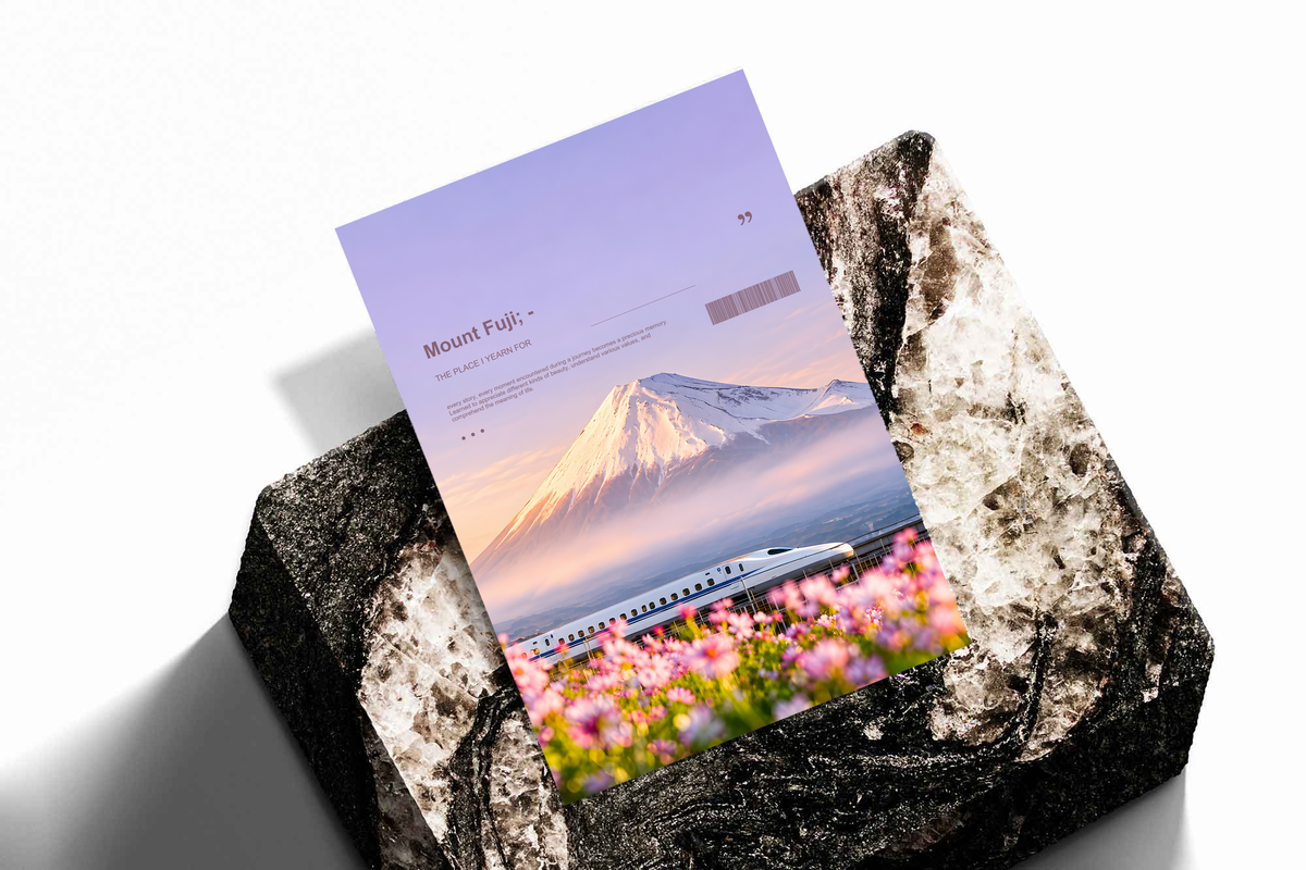 White bullet train below Mount Fuji with pink cosmos flowers; unframed print on a stone display