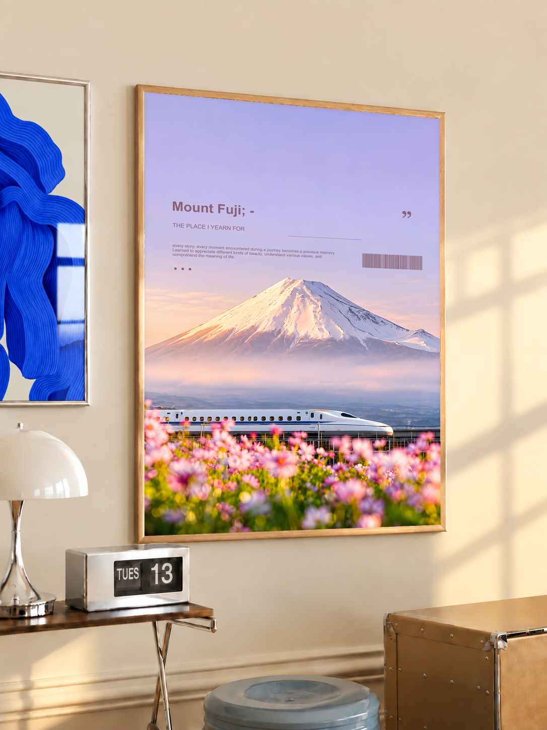 White bullet train below Mount Fuji with pink cosmos flowers; oak framed print in a desk setting