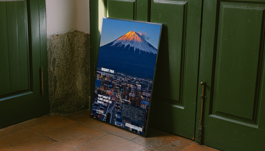 Mount Fuji sunset city poster in blue-edged frame, orange summit over night streets