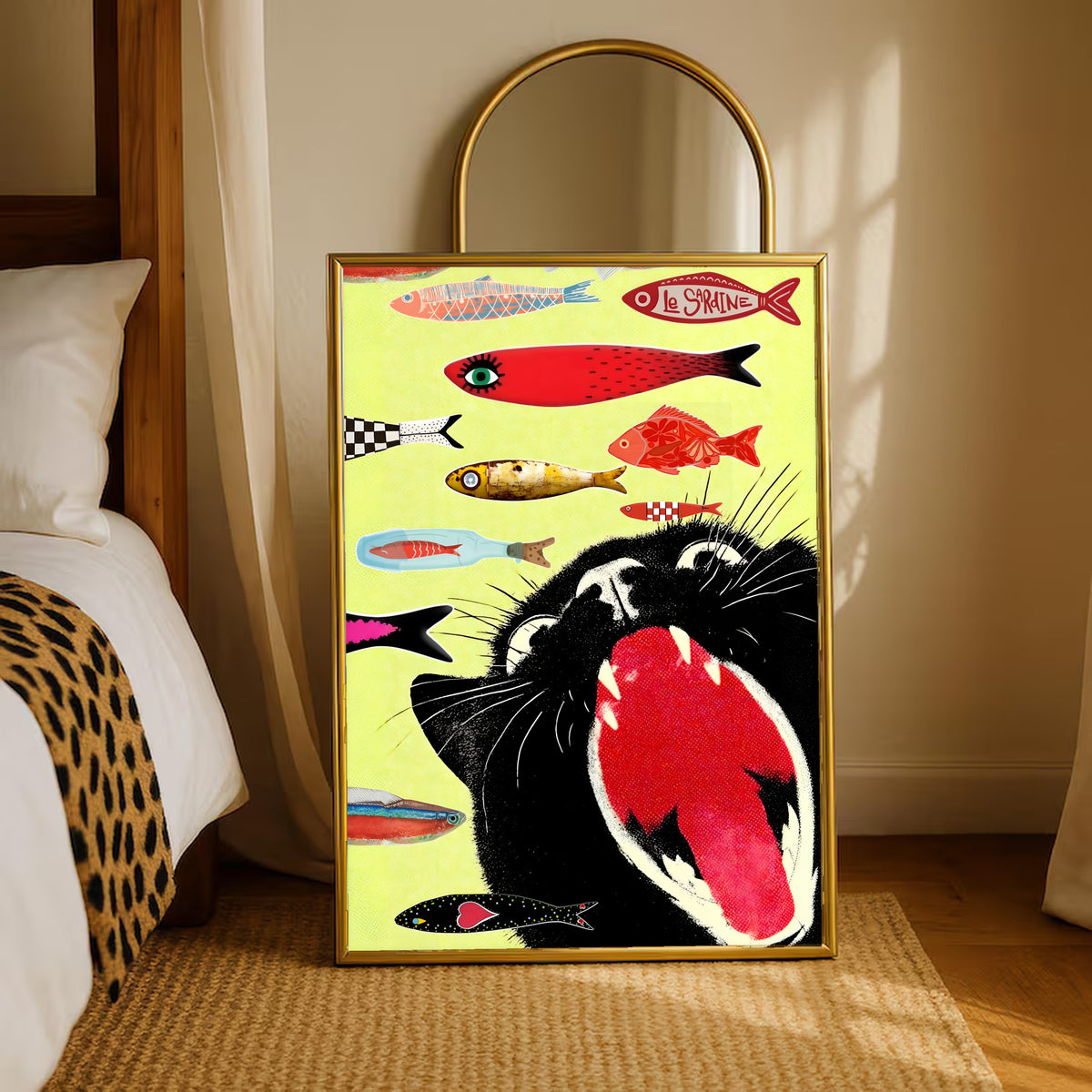 Gold-framed cat-and-fish poster standing on a bedside rug