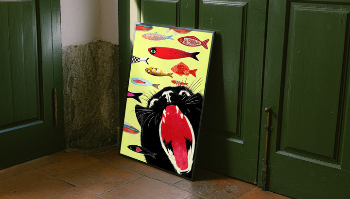 Framed yellow cat-and-fish poster leaning against green doors