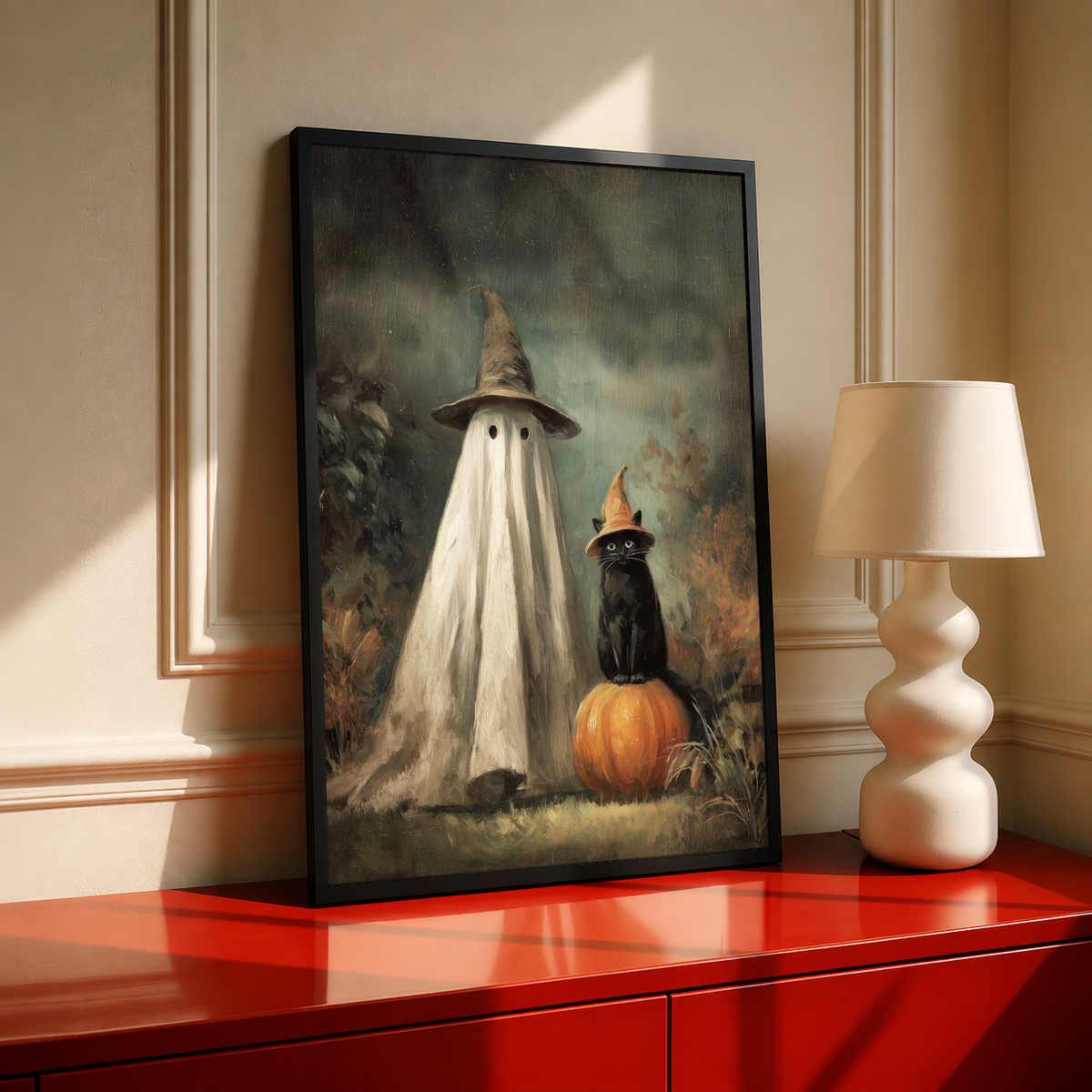 Ghost witch hat art print, black frame with hooded ghost, black cat, and orange pumpkin