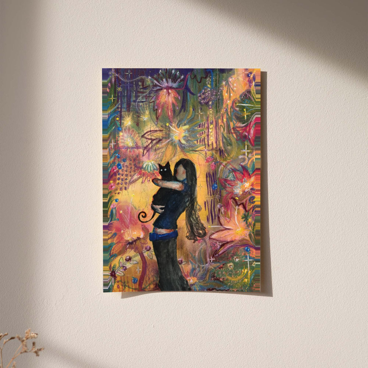 A girl embracing a black cat amid colorful ornamental flowers and patterns displayed without a visible frame on a softly lit pale wall