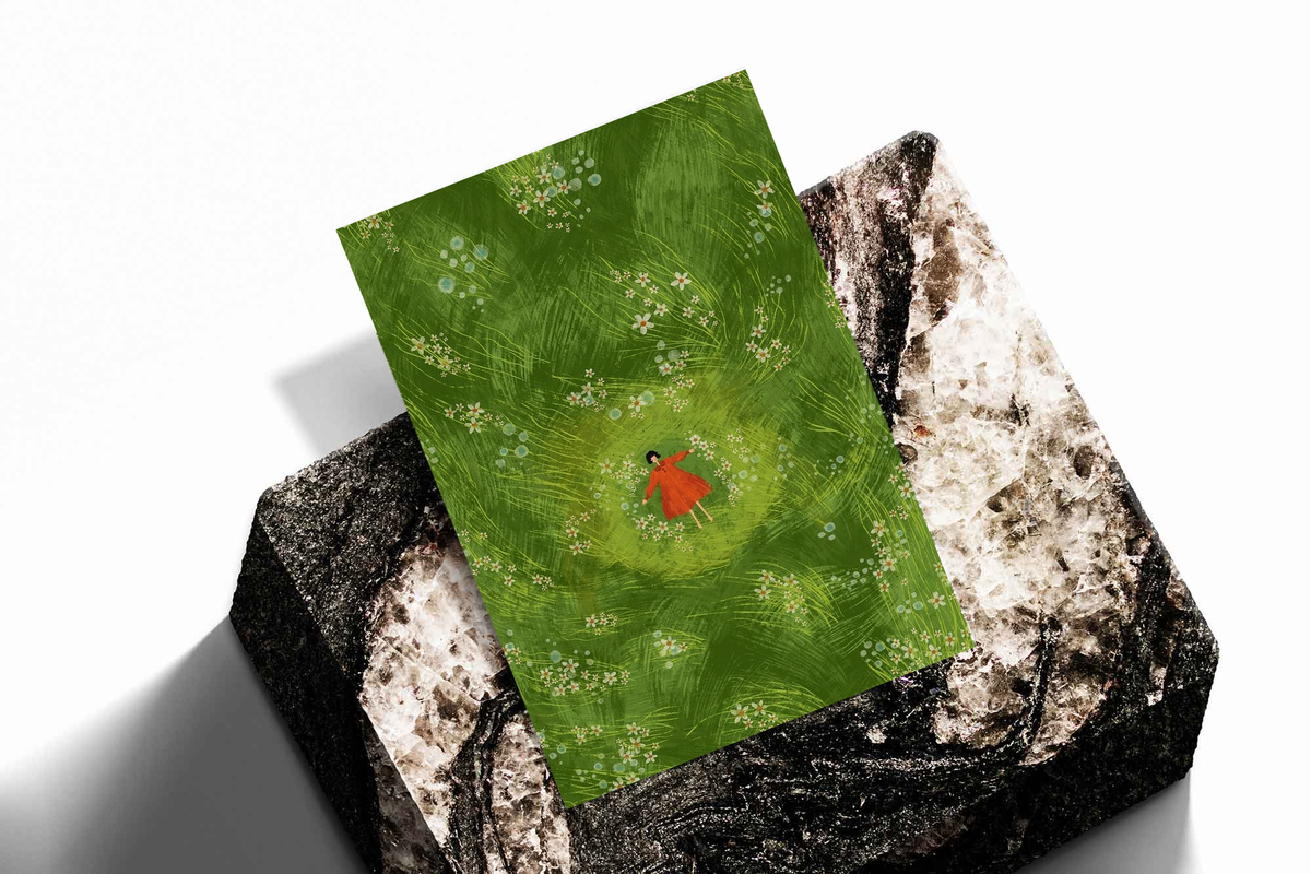 Girl in red dress in a green flower meadow as an unframed print propped against a pale wall on a rough stone