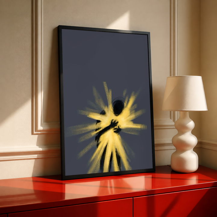 Glowing abstract human figure in a black frame on a red cabinet beside a cream lamp