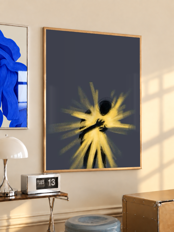 Glowing abstract human figure in an oak frame on a warm cream wall above a small table and dome lamp