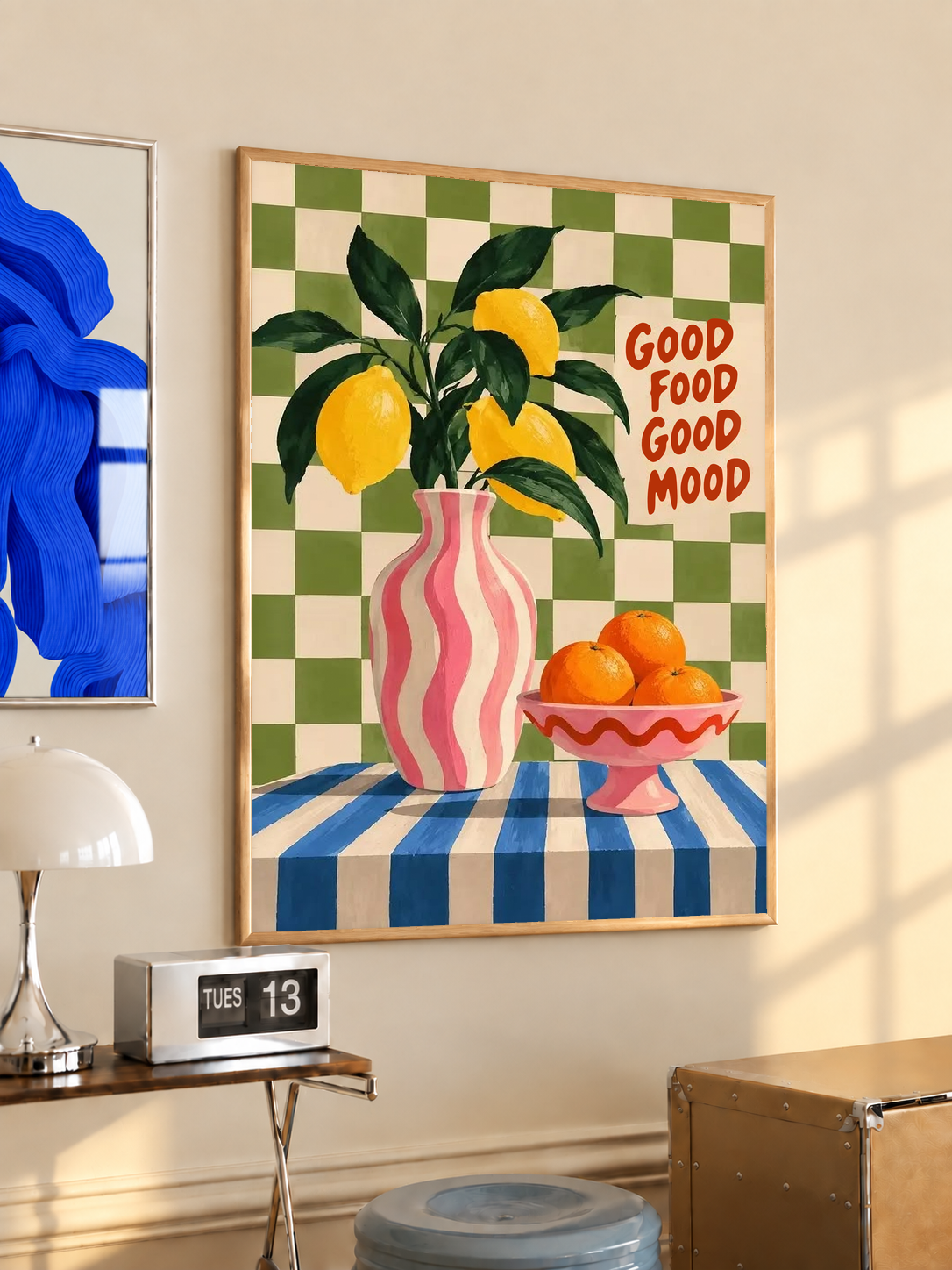 Citrus poster with lemons, pink striped vase, green checkered border, and “Good Food Good Mood”.