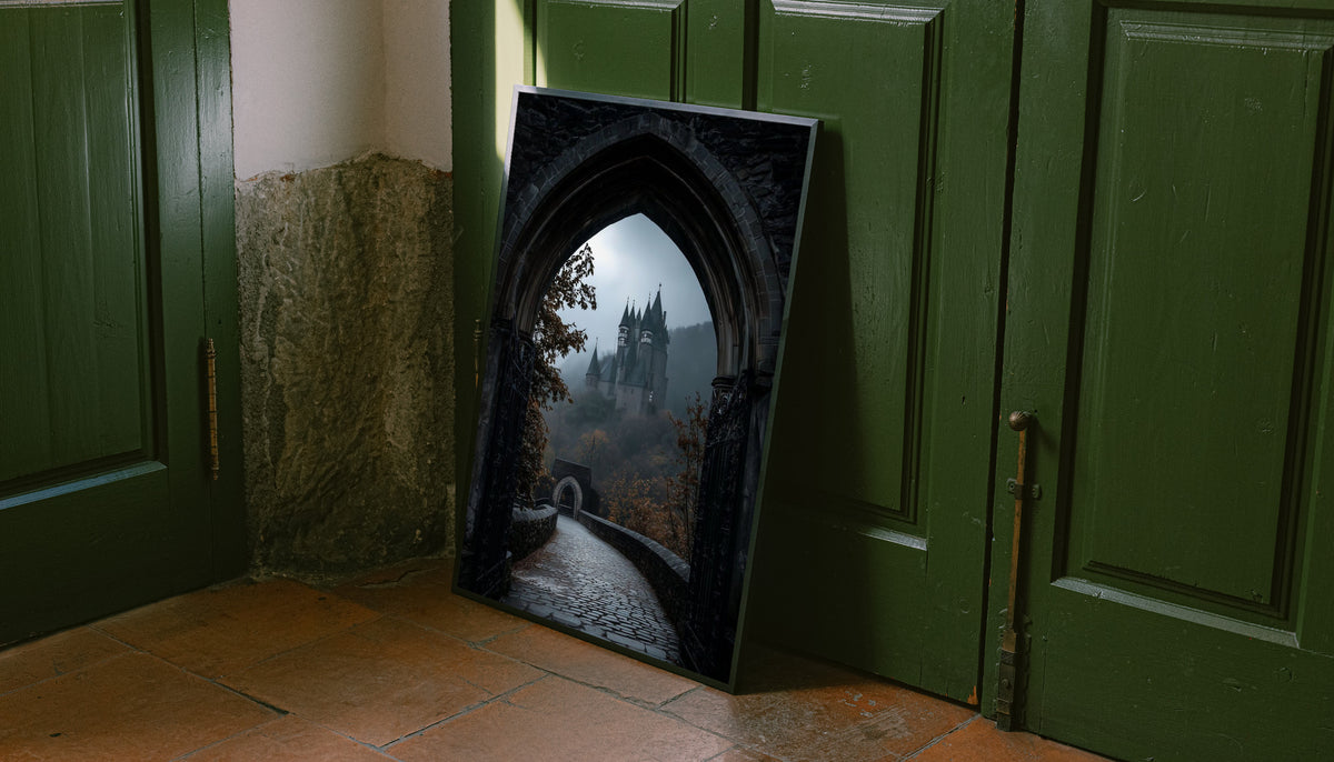 A distant gothic castle seen through a pointed stone arch above a cobbled path leaning on the floor against dark green wall panelling