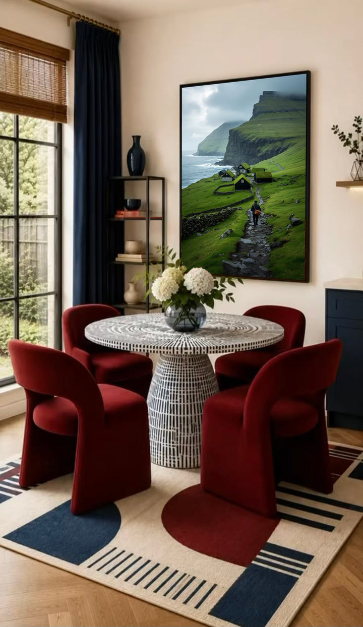 Framed landscape wall art with green hills, houses, and a hiker by a rocky path